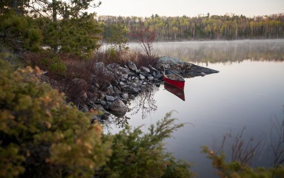 Red canoe on a lake