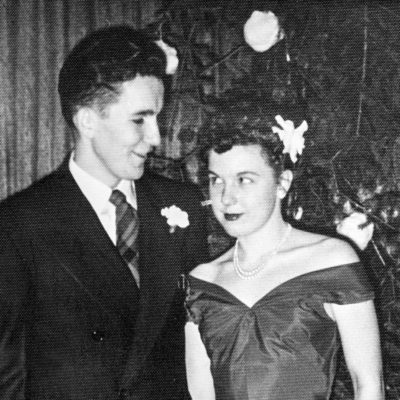 Couple in front of a Christmas tree