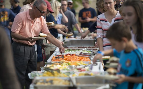 Northland College faculty eat at outdoor buffet