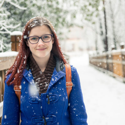 Northland College student in the snow