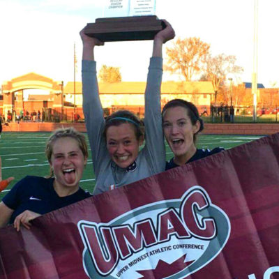 Women's soccer celebrating their UMAC conference title