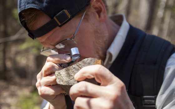 Tom Fitz looking at rock