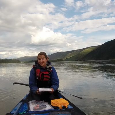 Northland College alum Mitzi Peine paddling a canoe