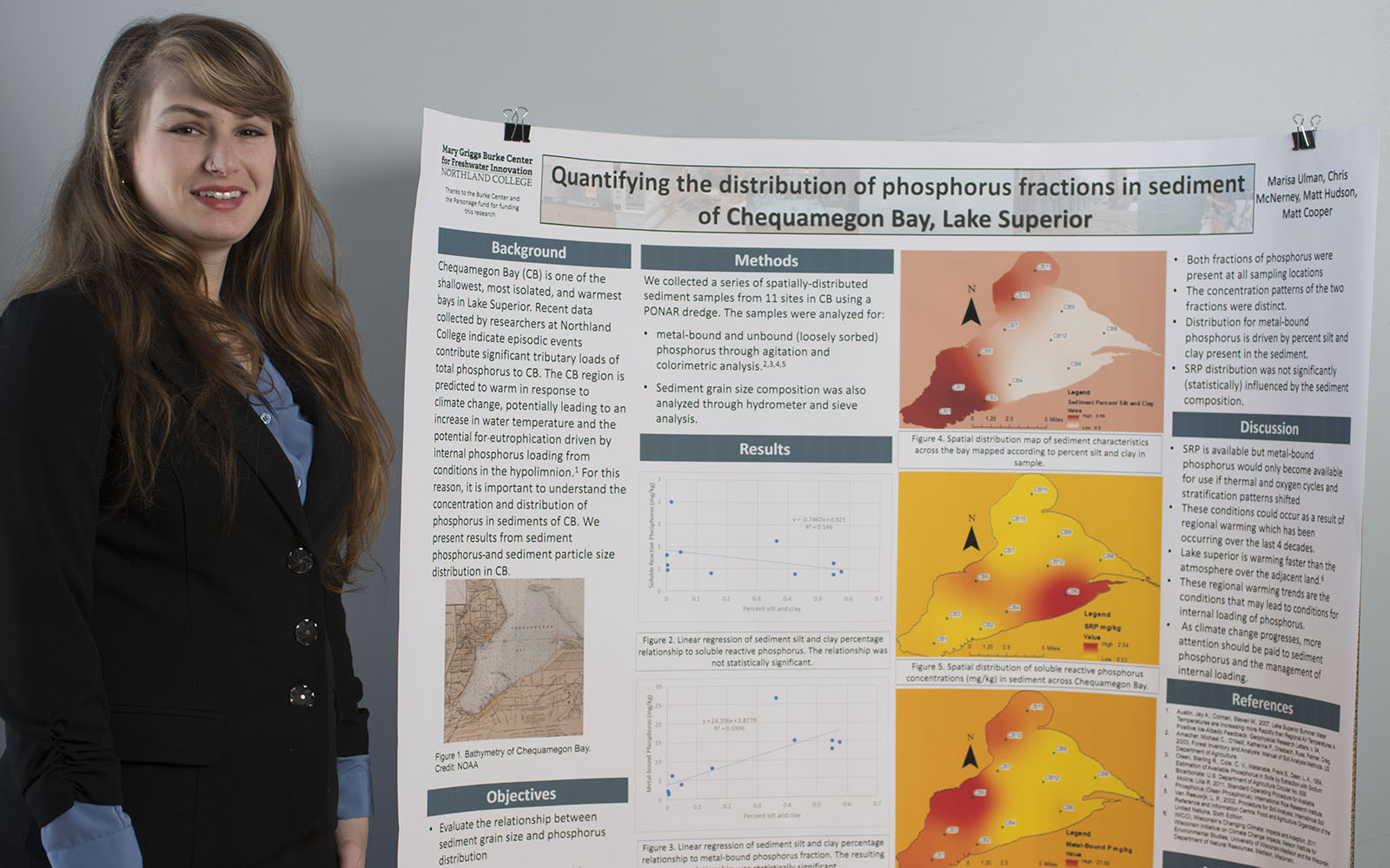 Northland College student Marisa Ullman stands next to her winning academic poster