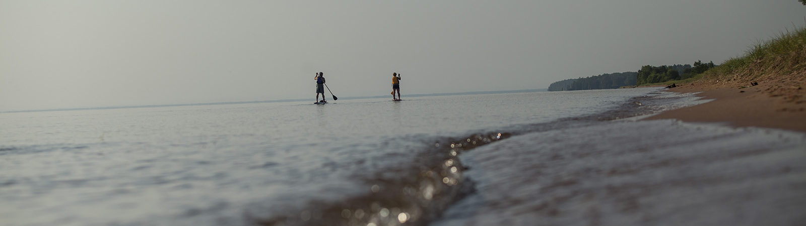 Two paddle boarders on Lake Superior