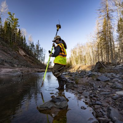 Surveyor collects data on North Fish Creek in northern Wisconsin.