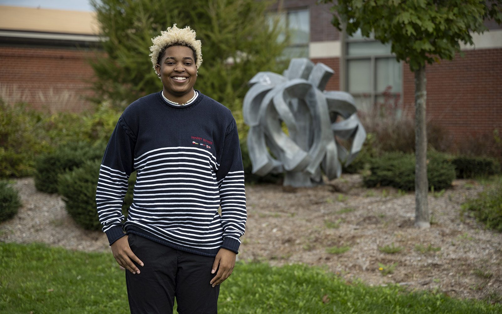 Northland College student standing on campus. 