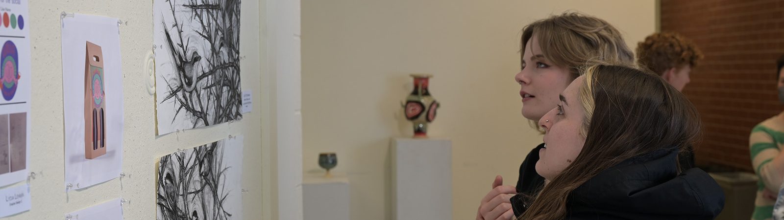Students view an art exhibit
