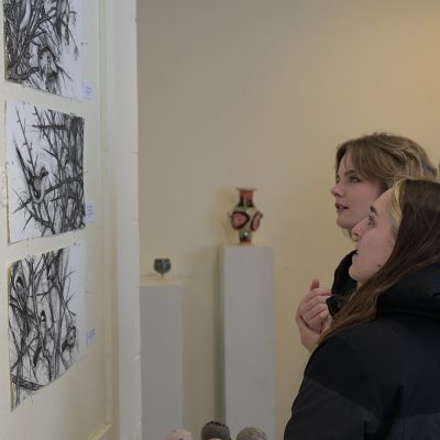 Students view an art exhibit