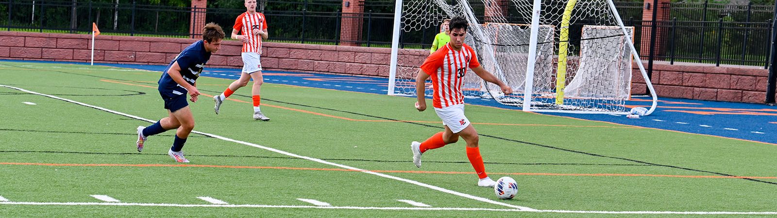 LumberJack athlete with a soccer ball during a game.
