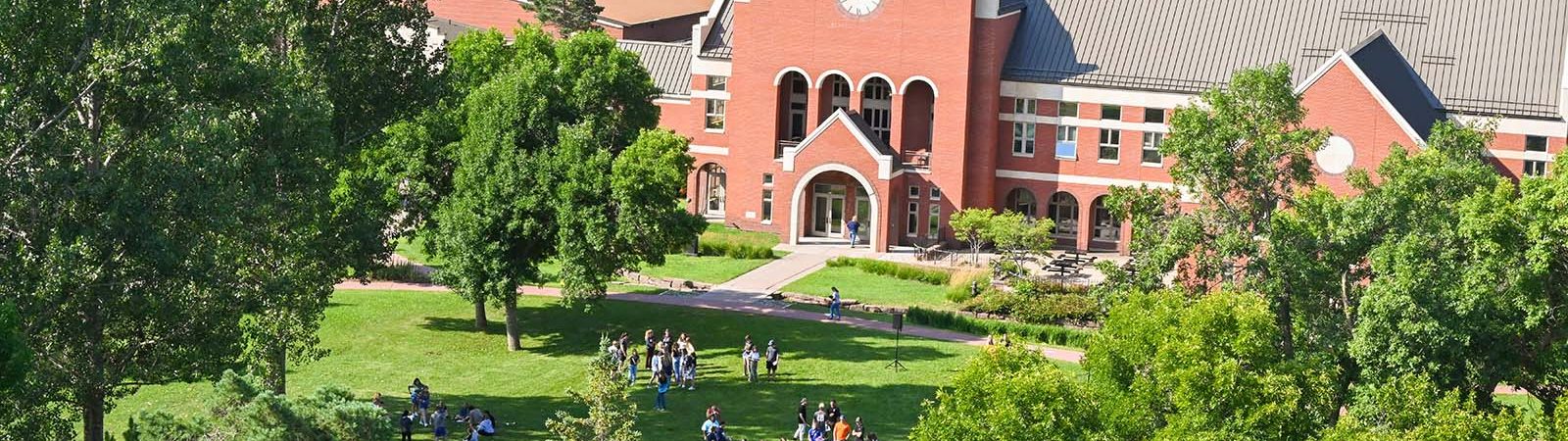 Ponzio Campus Center with students on the Mall.
