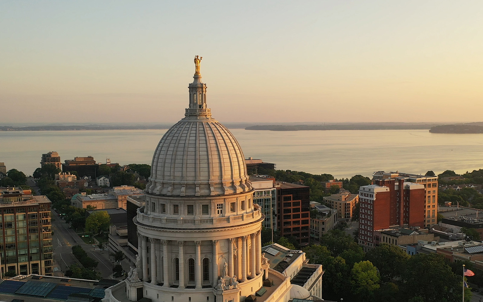 Photo taken above Capitol Square in Madison, Wisconsin, with the State Capitol and Lake Mendota in view